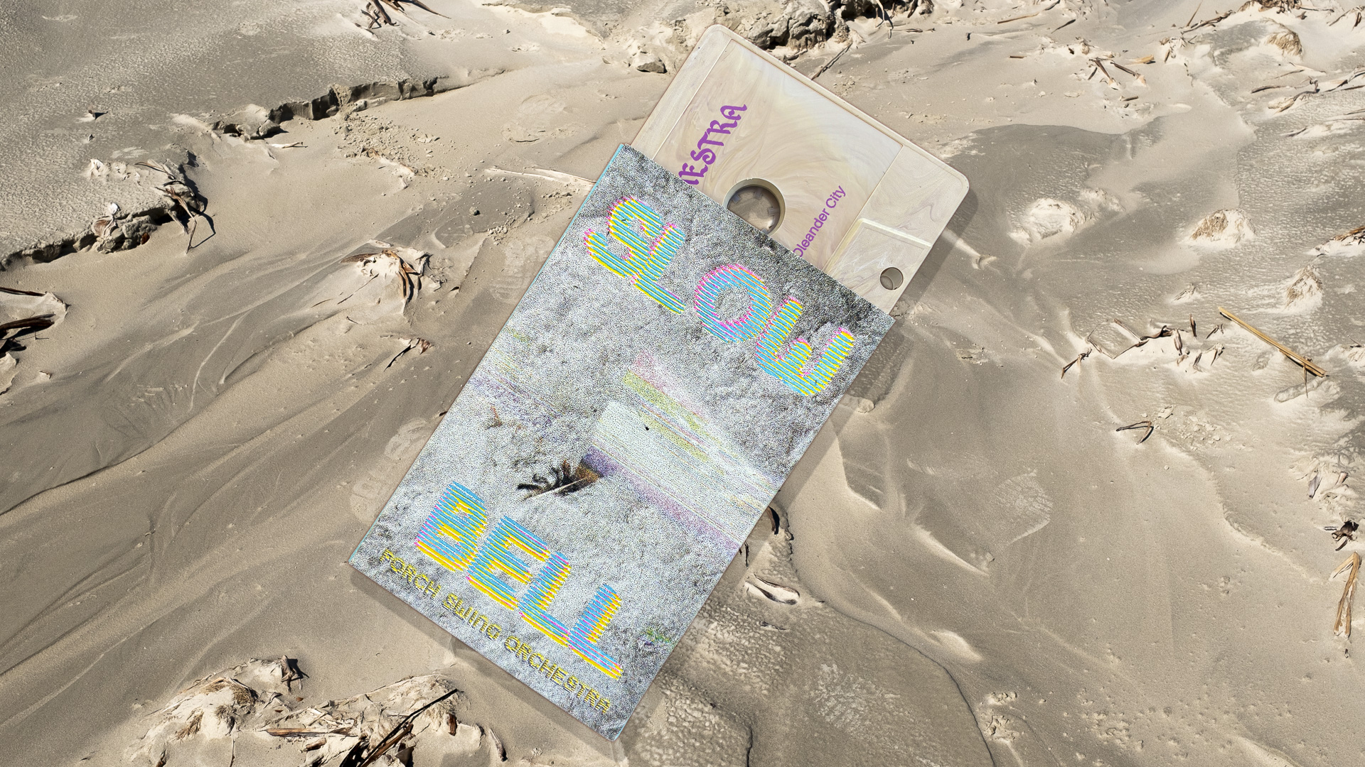 Slow Bell cassette and riso-printed o-card on Galveston beach